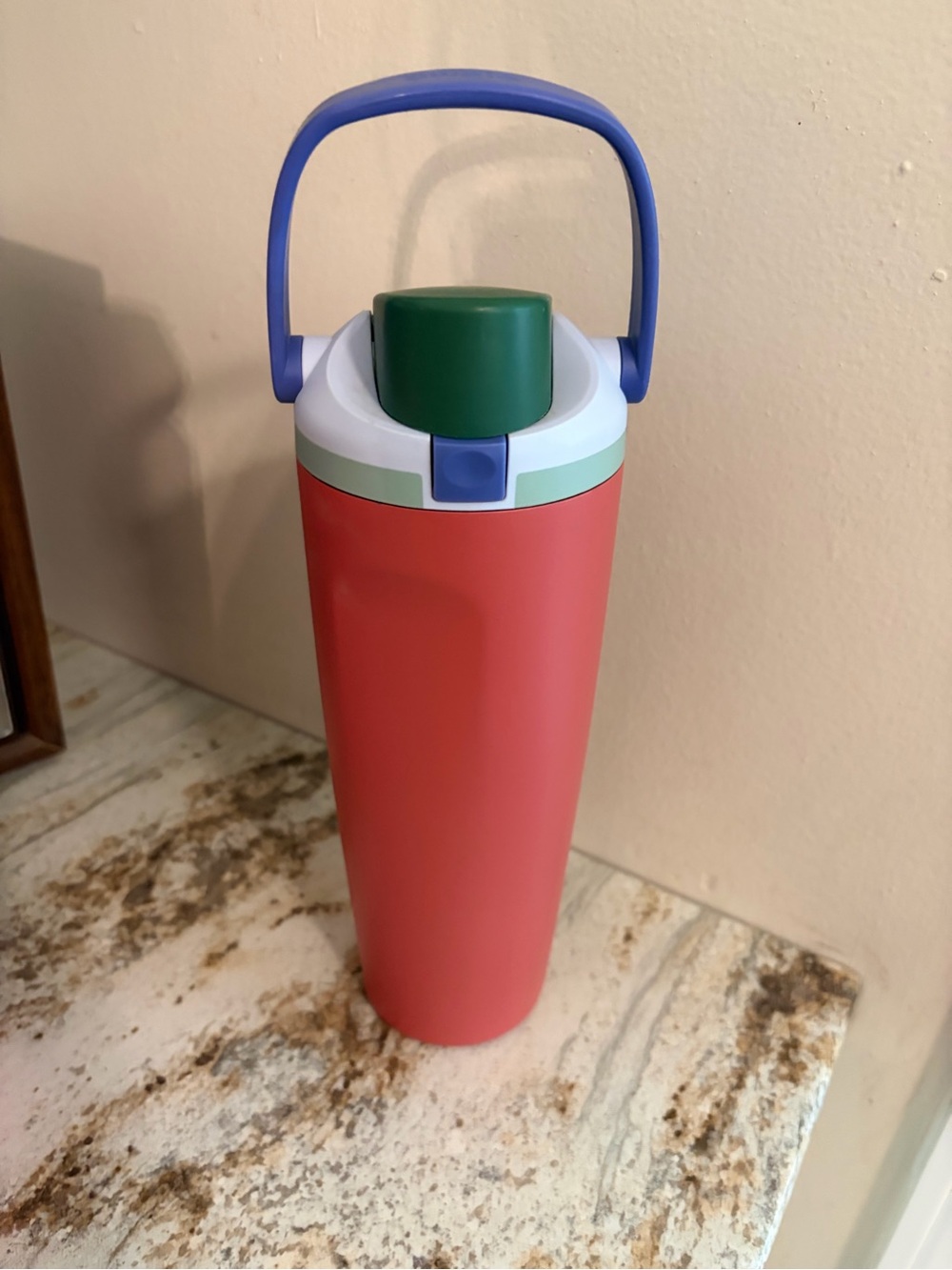 Coral Travel Bottle with Green Cap and Blue Handle
